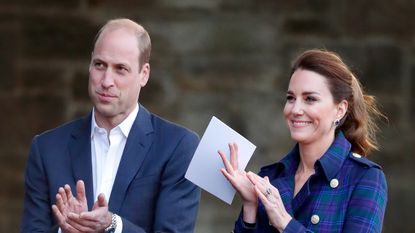 Prince William, Duke of Cambridge and Catherine, Duchess of Cambridge (holding her notes before making a speech) host a drive-in cinema screening of Disney's 'Cruella' for Scottish NHS workers at The Palace of Holyroodhouse on May 26, 2021