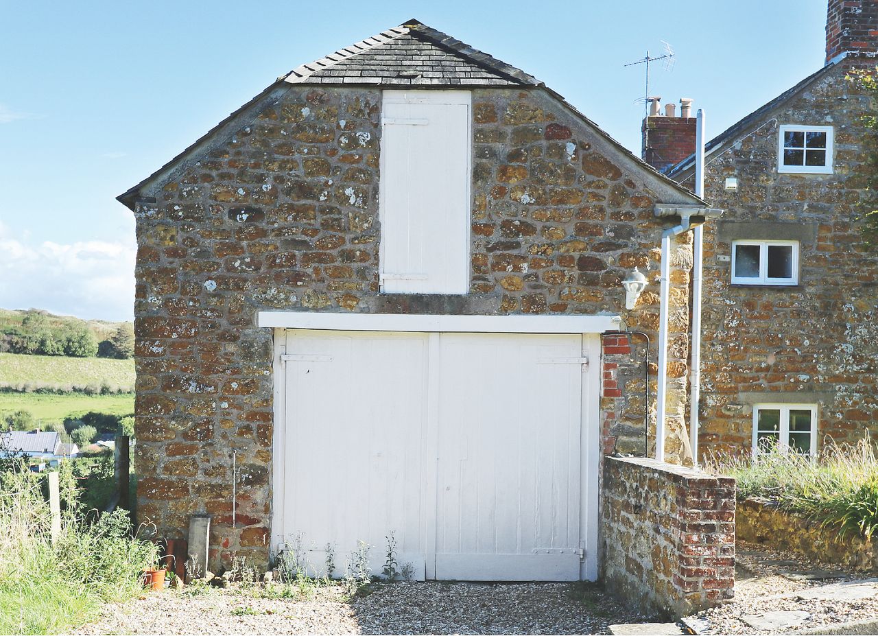 before image of stone garage