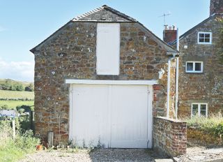 before image of stone garage 