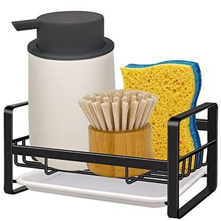 A black metal wire dish sponge caddy for beside the sink with a soap dispenser, yellow sponge, and bamboo brush on it.