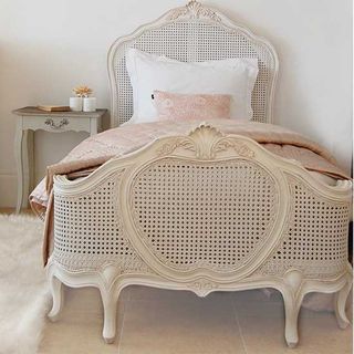 sophisticated bed with mahogany frame and woven rattan design