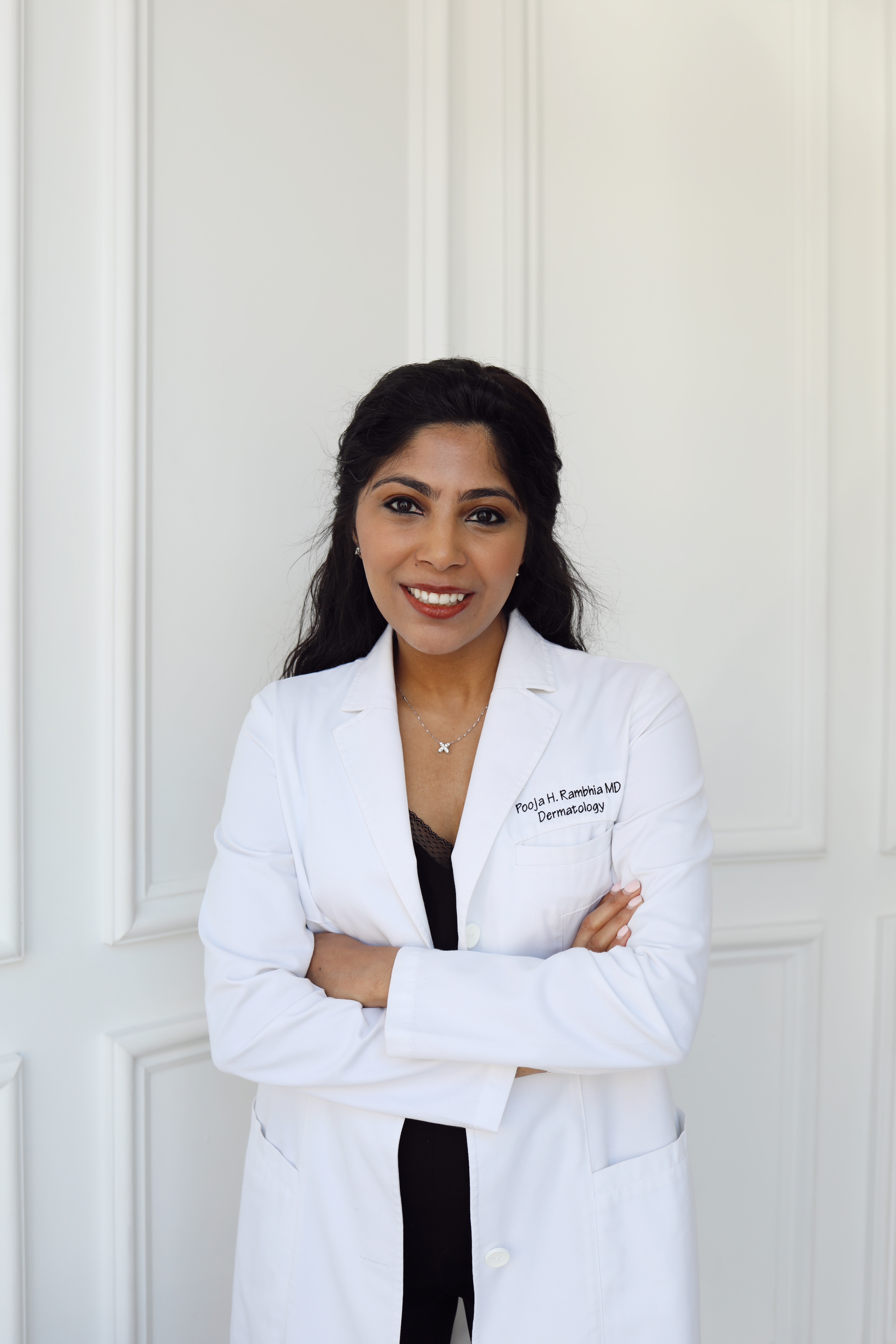 Dr. Pooja Rambhia in a white lab coat