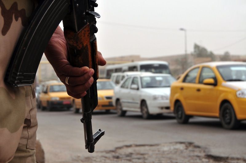 Iraqi soldier in Baghdad traffic