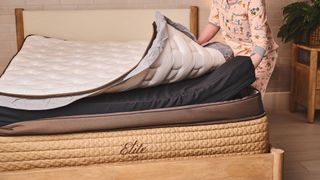 A tom's Guide mattress tester showing the different layers of the Helix Midnight Elite