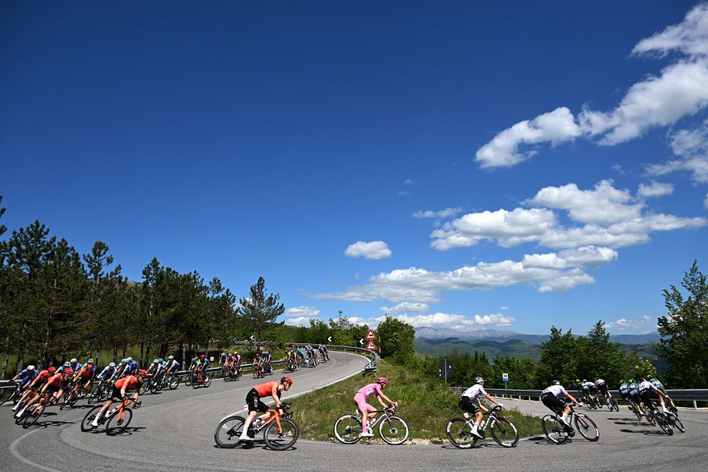 PRATI DI TIVO ITALY MAY 11 LR Connor Swift of The United Kingdom and Team INEOS Grenadiers Tadej Pogacar of Slovenia and UAE Team Emirates Pink Leader Jersey Rafal Majka of Poland and UAE Team Emirates and general view of the peloton compete climbing to the Albaneto 1032m during the 107th Giro dItalia 2024 Stage 8 a 152km stage from Spoleto to Prati di Tivo 1451m UCIWT on May 11 2024 in Prati di Tivo Italy Photo by Tim de WaeleGetty Images