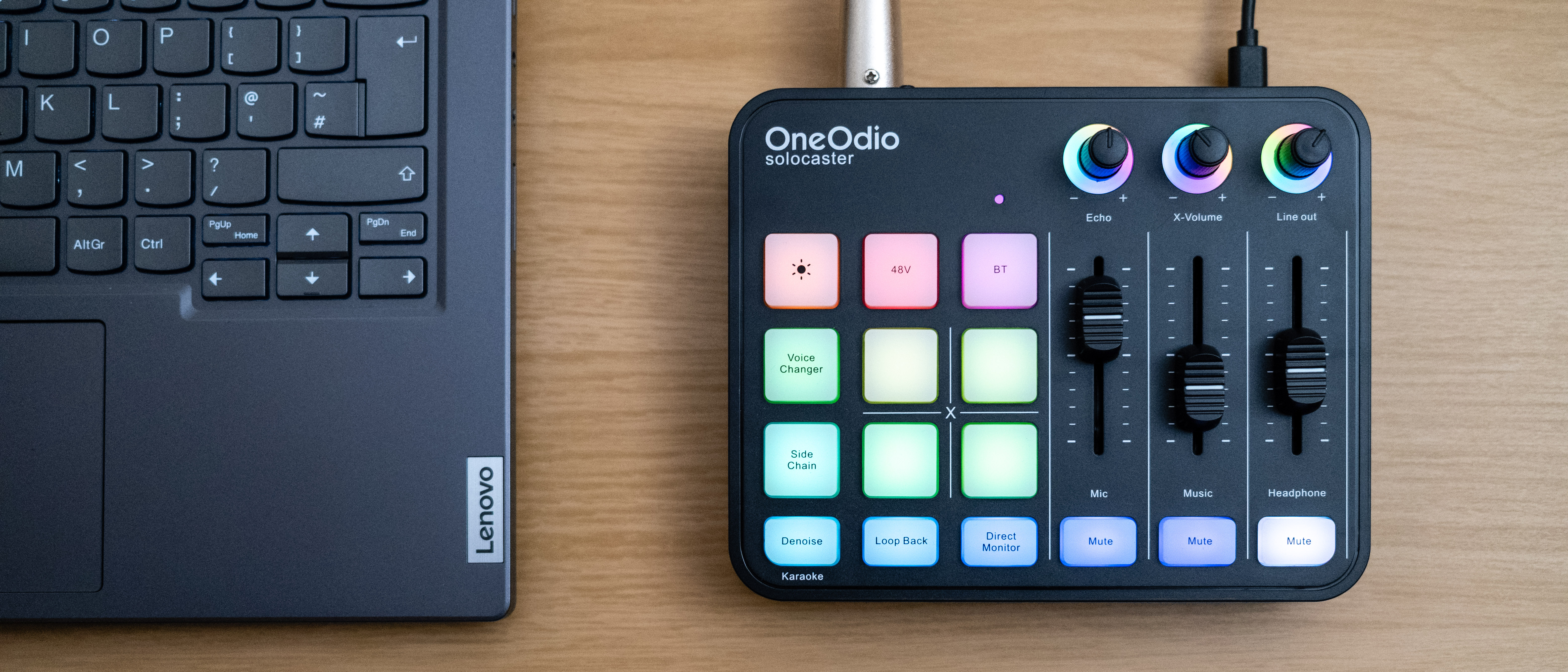 OneOdio solocaster next to a laptop