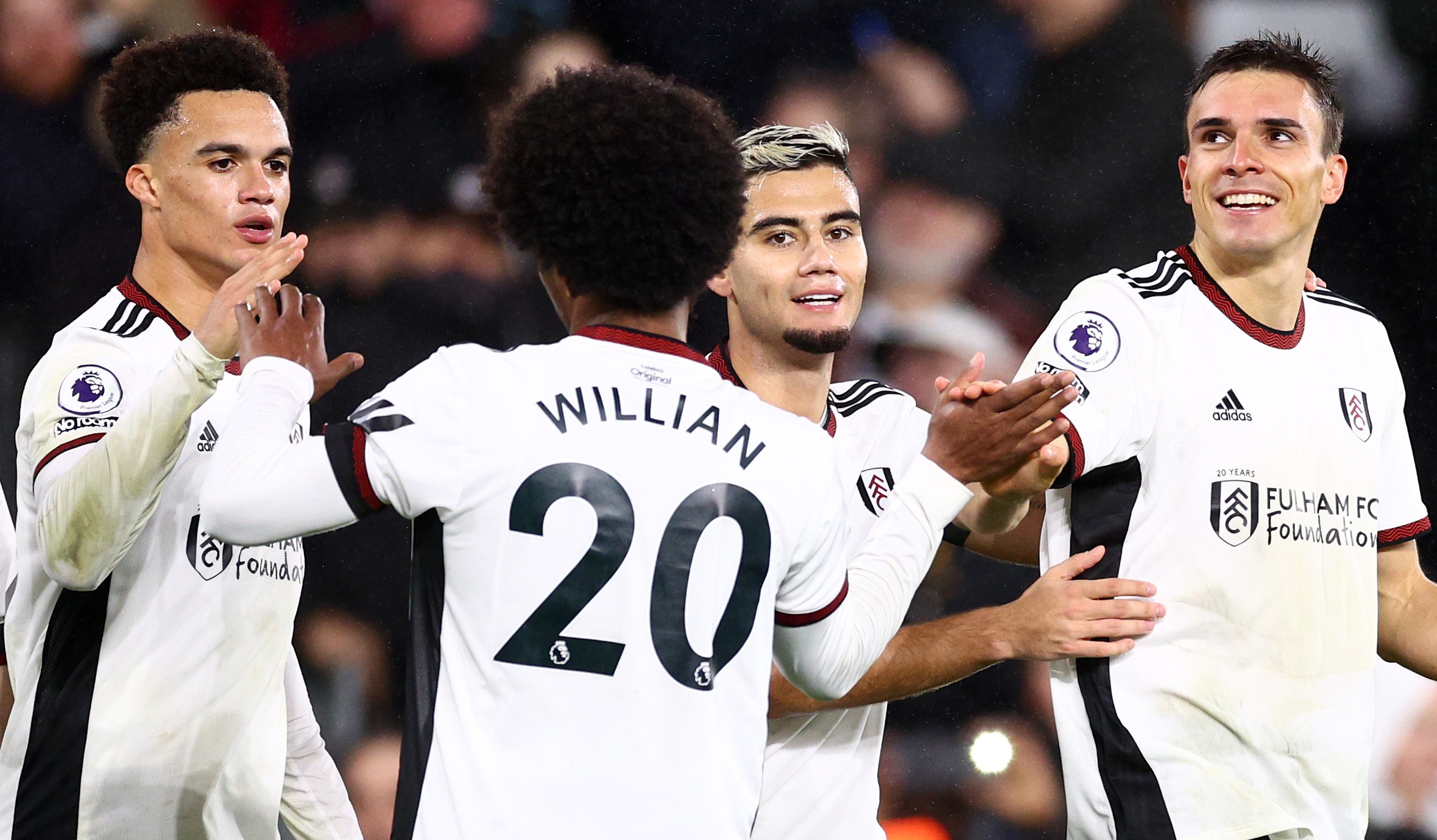 Joao Palhinha of Fulham celebrates with teammates after scoring the team's second goal during the Premier League match against Southampton FC at Craven Cottage on December 31, 2022 in London, England.