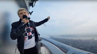 Billy Idol singing at the top of the Empire State Building