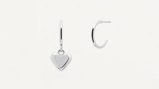 A pair of silver hoops, one with a heart pendant, one of the best personalized jewelry gifts.