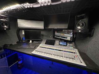 A look inside the Red House Streaming truck with monitors, speakers and mixing console.