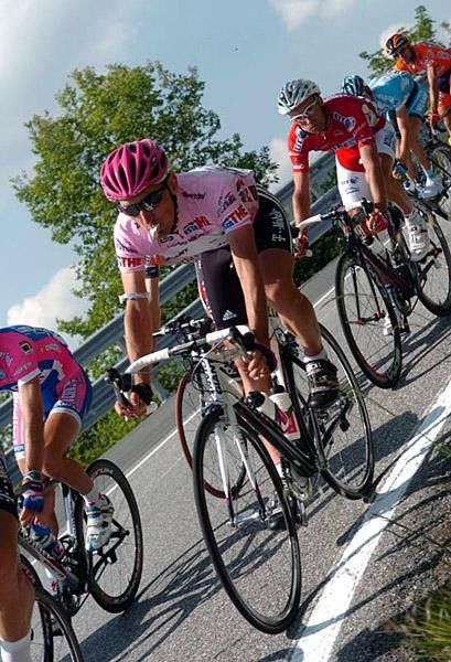 The maglia rosa chows down on some food during stage 9.