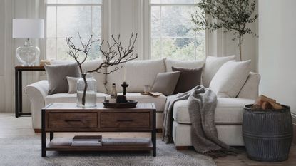 living room with white and wood scheme by furniture village