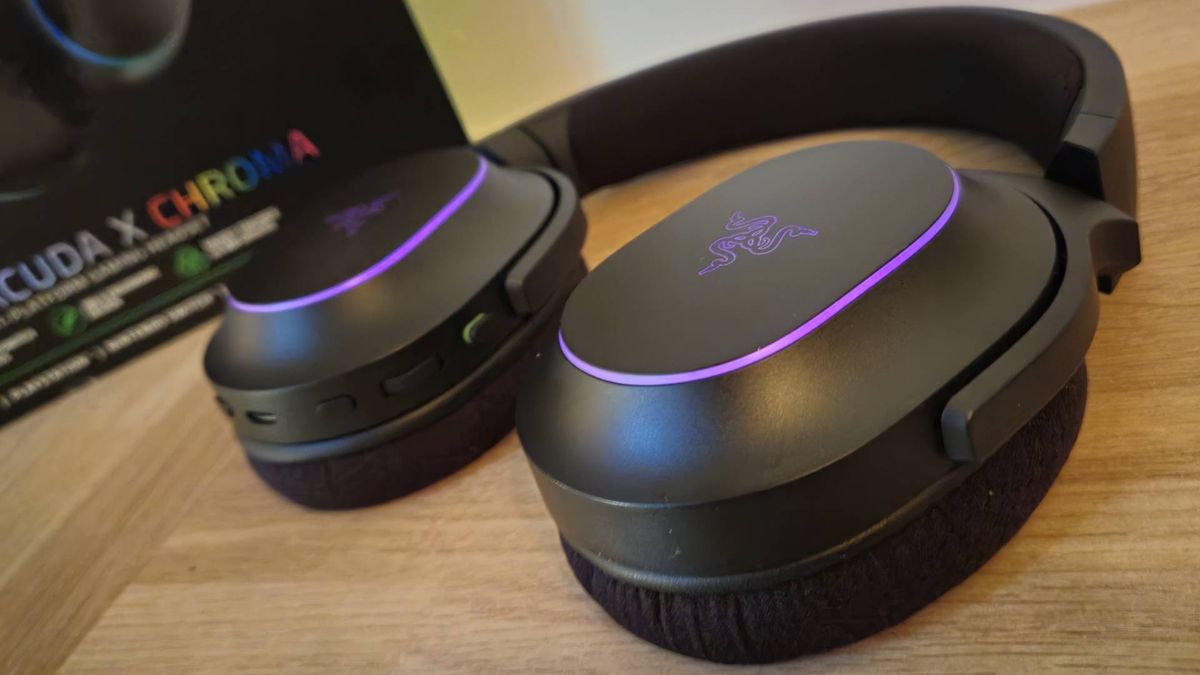 Image of the Razer Barracuda X Chroma gaming headset on a wooden countertop taken by author Rosalie Newcombe.