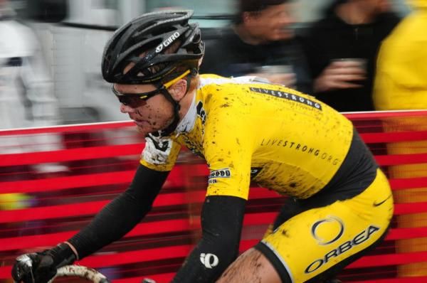 A Livestrong rider riding past the crowd