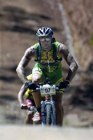 German rider Kai Hundertmarck crests a small rise in the road during the 2005 Crocodile Trophy.