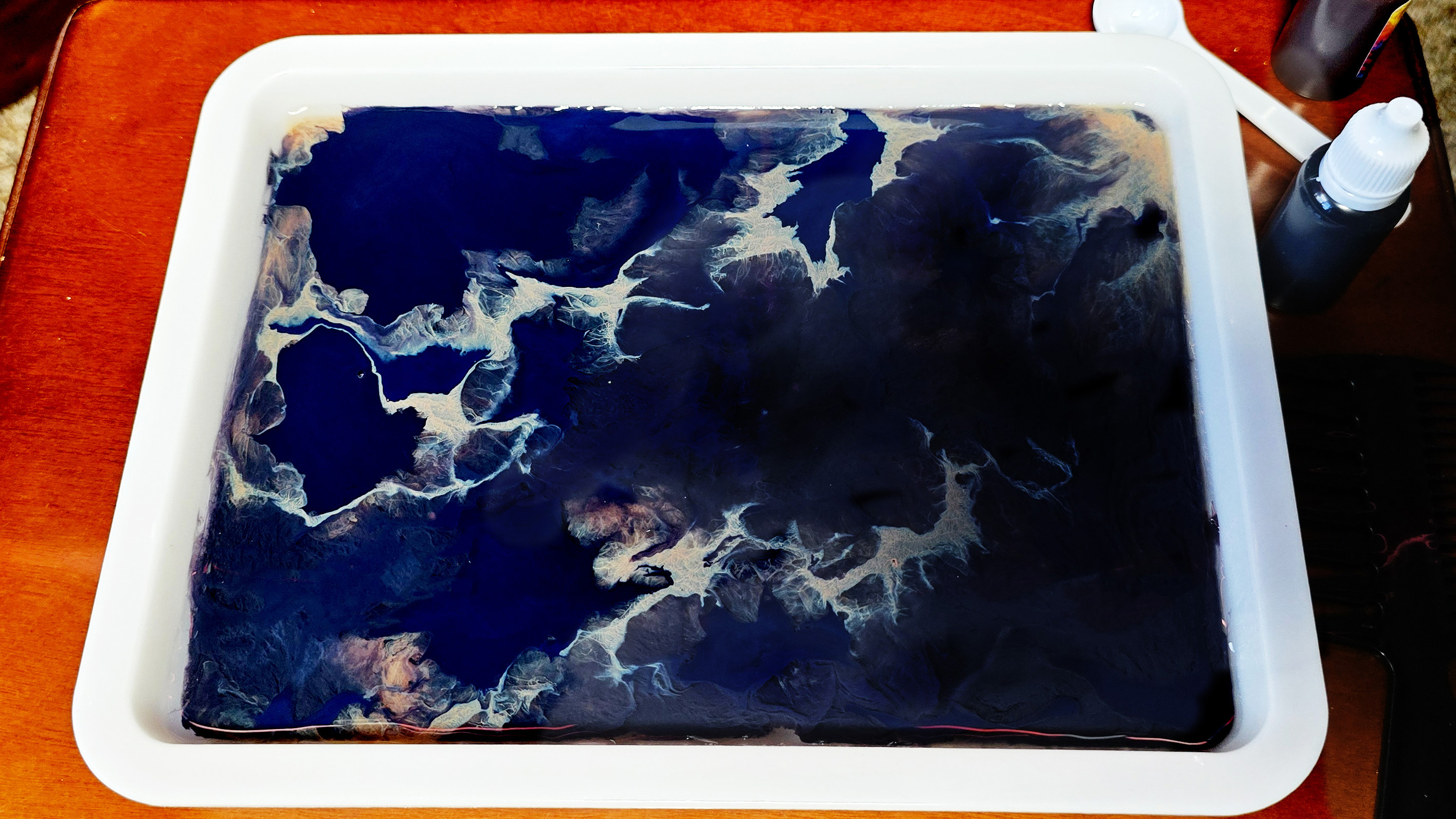 Drop in the ink and stir but get shooting quickly before it all sinks