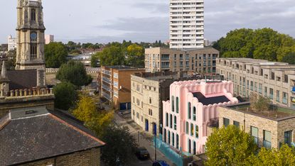 colourfully pink Cloud House by Peter Morris stands out on its street