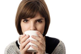 She's holding a warm cup o' Joe, so now's the time to approach for a favor, at least according to new research suggesting when we hold warm objects we are more generous.