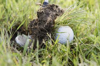 Shot hittting turf not ball in rough GettyImages-139891993