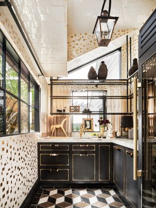 Sunroom with tiled ceiling and black cabinetry