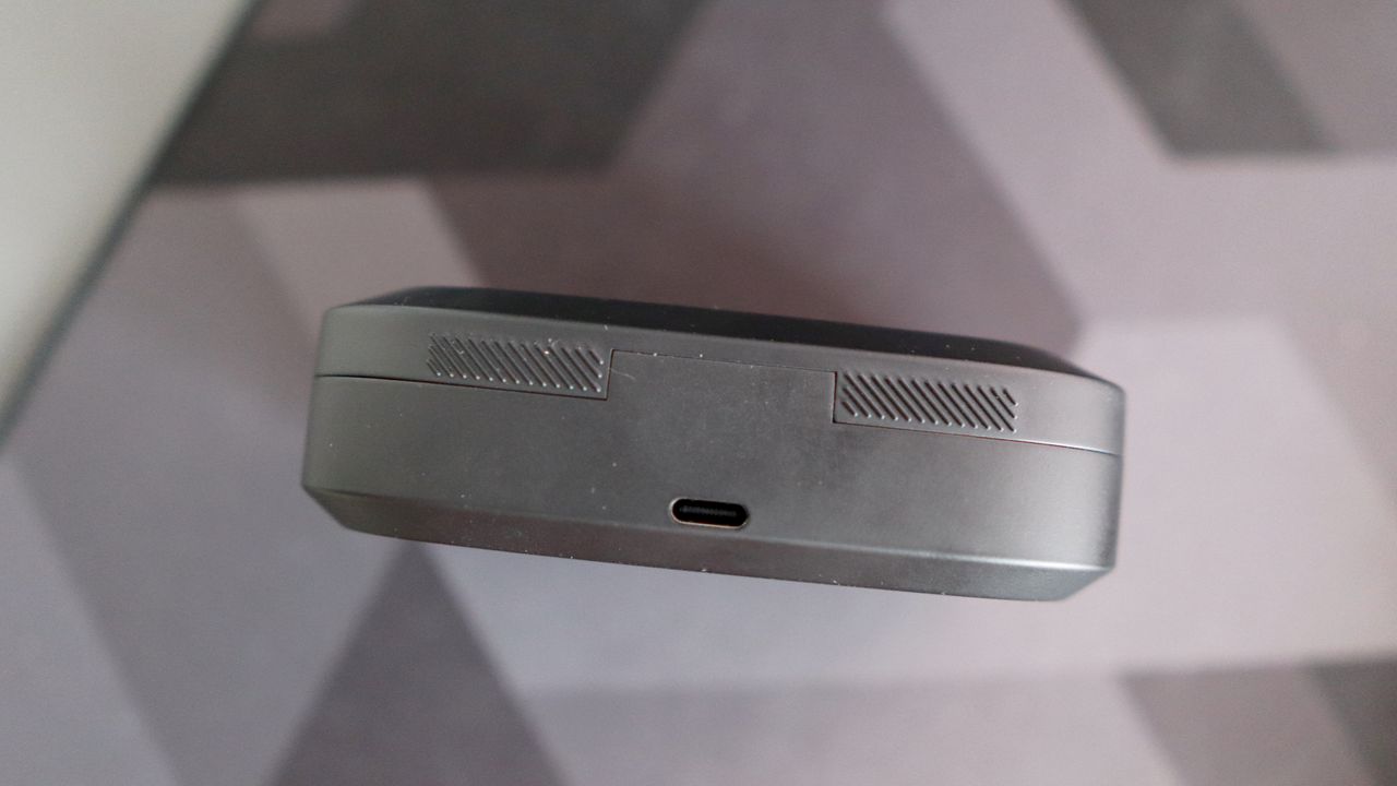 Asus ROG Cetra Open earbuds on a deskmat.