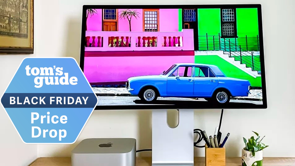 An Apple Studio Display next to a Mac mini M2 with a Tom's Guide Black Friday deals badge