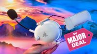 The Razer BlackShark V2 Pro being held in a hand in front of a colorful landscape scene. A graphic on the image says "Major Deal."