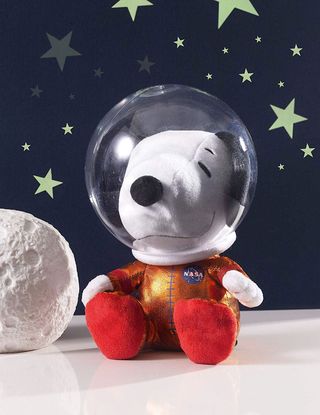 The Astronaut Snoopy plush doll flown to the International Space Station stands 8 inches tall and was made by Hallmark.