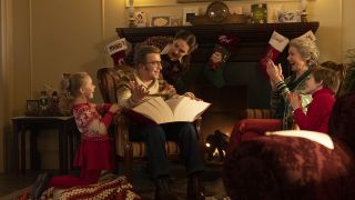 The Parkers seated around a cozy fire in A Christmas Story Christmas
