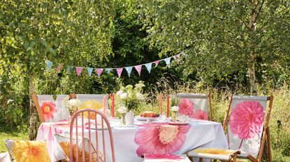 table and chairs with dahlia print cloth and cushions