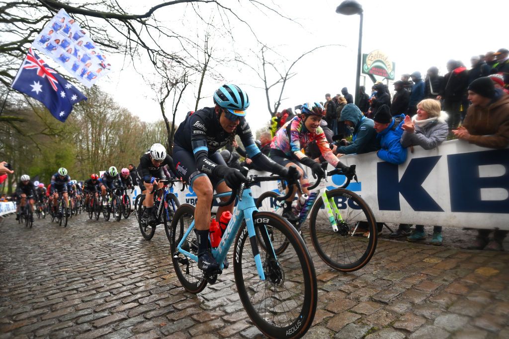 WEVELGEM BELGIUM MARCH 26 LR Lucinda Brand of The Netherlands and Team Trek Segafredo and Elise Chabbey of Switzerland and Team CanyonSRAM Racing compete passing through a Kemmelberg cobblestones sector during the 12th GentWevelgem In Flanders Fields 2023 Womens Elite a 1625km one day race from Ypres to Wevelgem UCIWWT on March 26 2023 in Wevelgem Belgium Photo by Luc ClaessenGetty Images