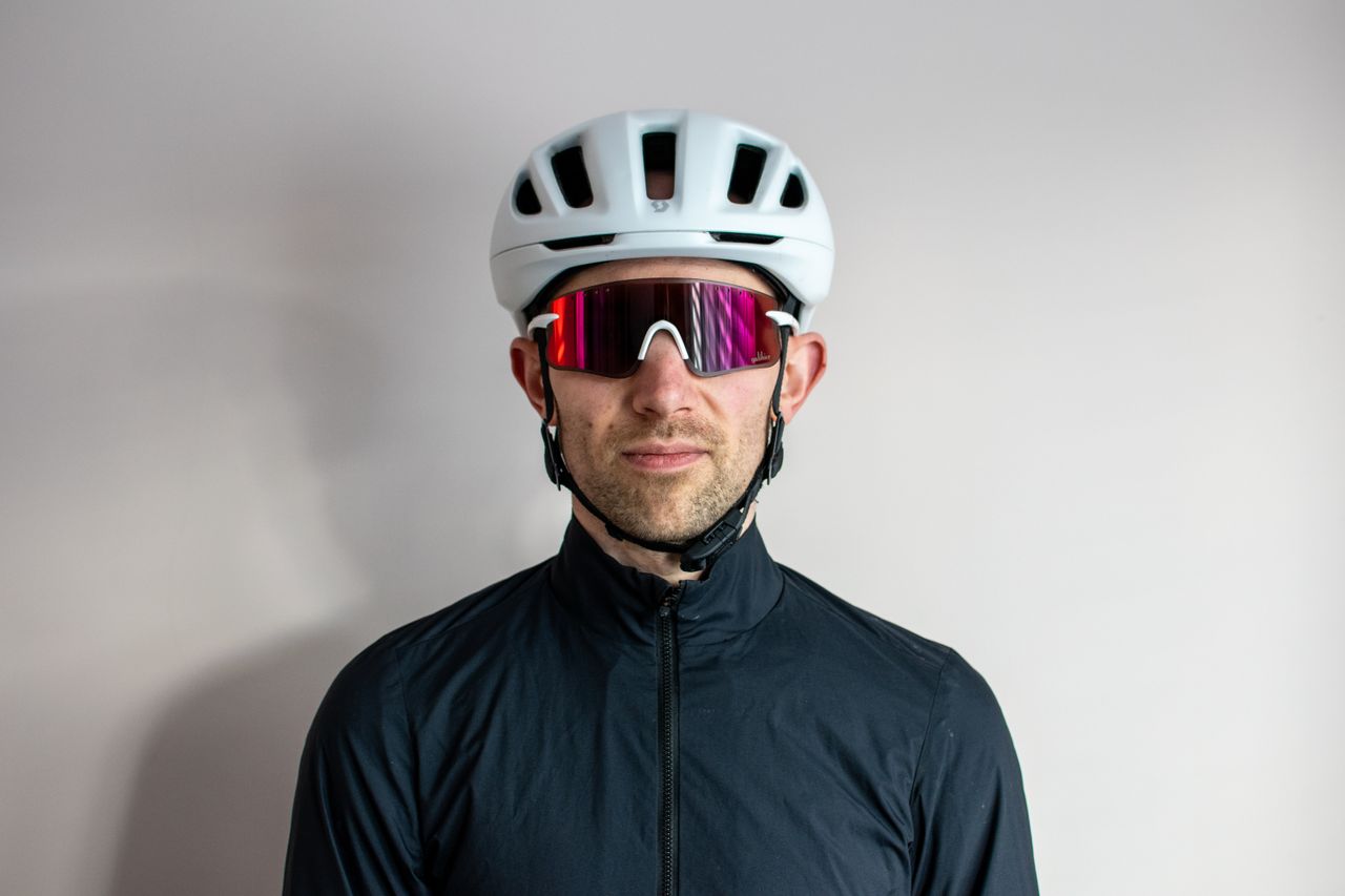 A man wearing a pair of white Galibier Grand Tour sunglases