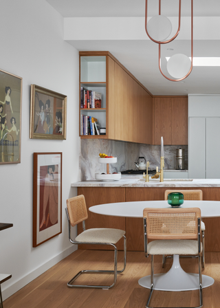 A dining room with rattan style chairs