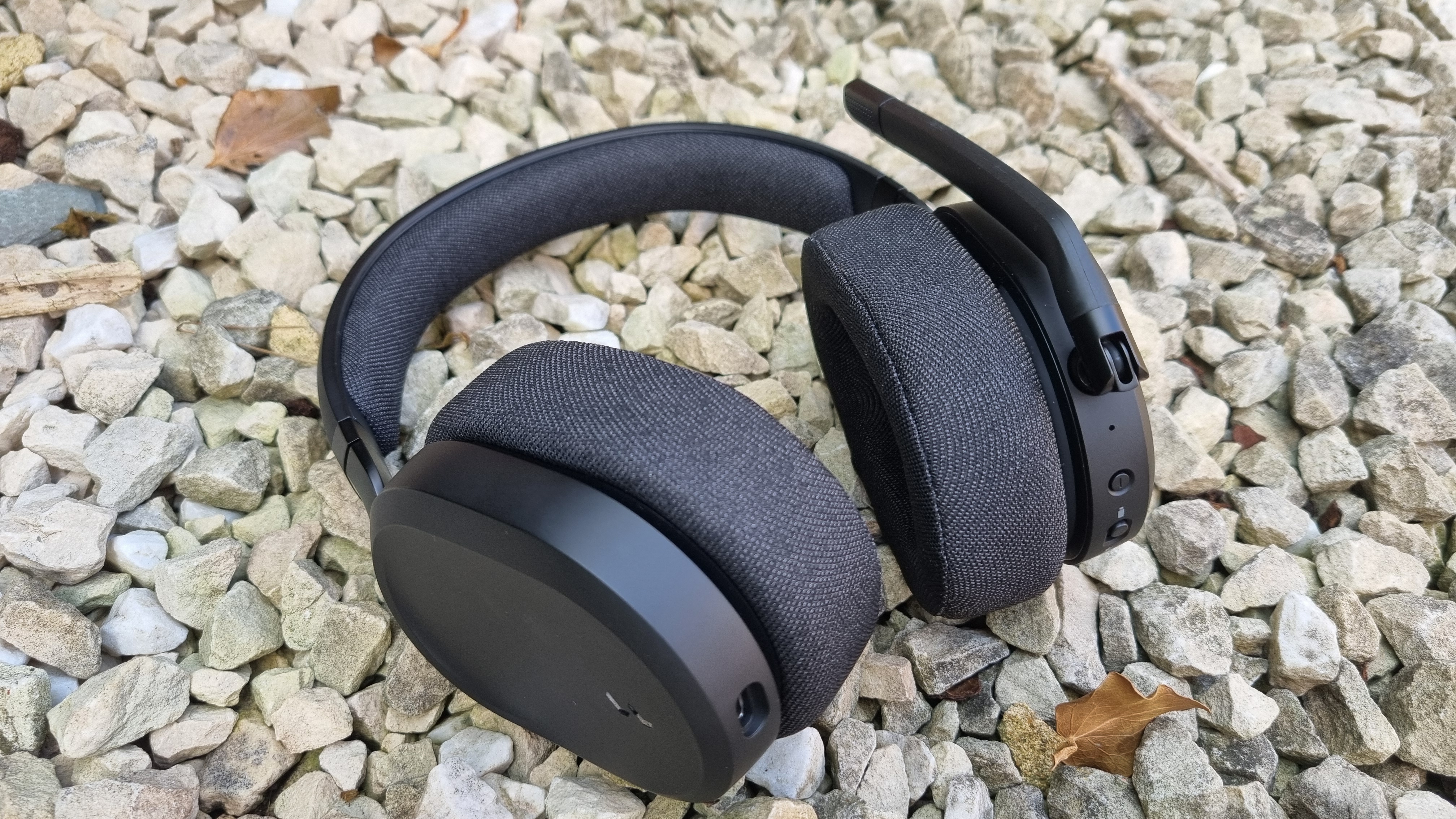 The Fractal Scape gaming headset on a white gravel background