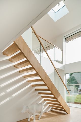 white interiors with delicate staircase