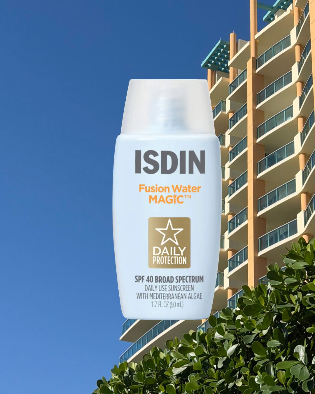 An image of the Isdin Fusion Water Magic sunscreen laid over an image of a hotel Brascia shot in Miami.