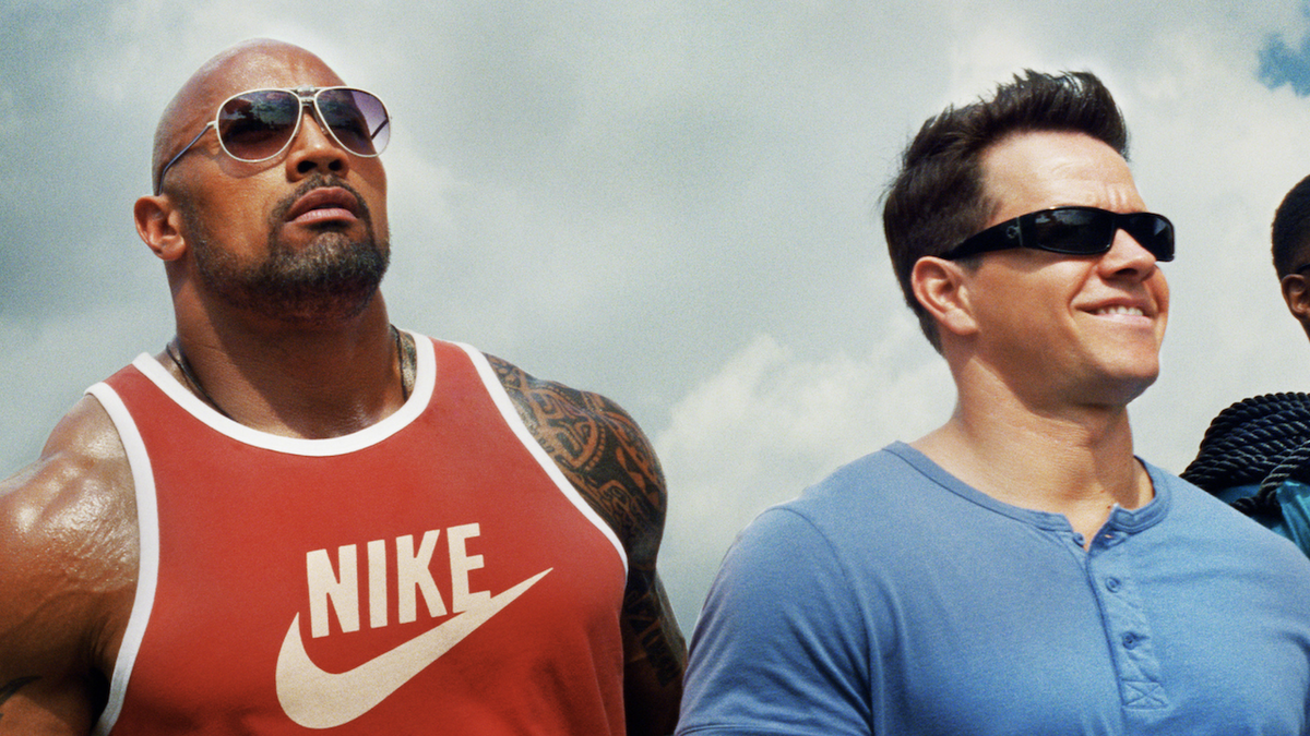 Dwayne Johnson and Mark Wahlberg side by side in Pain &amp; Gain