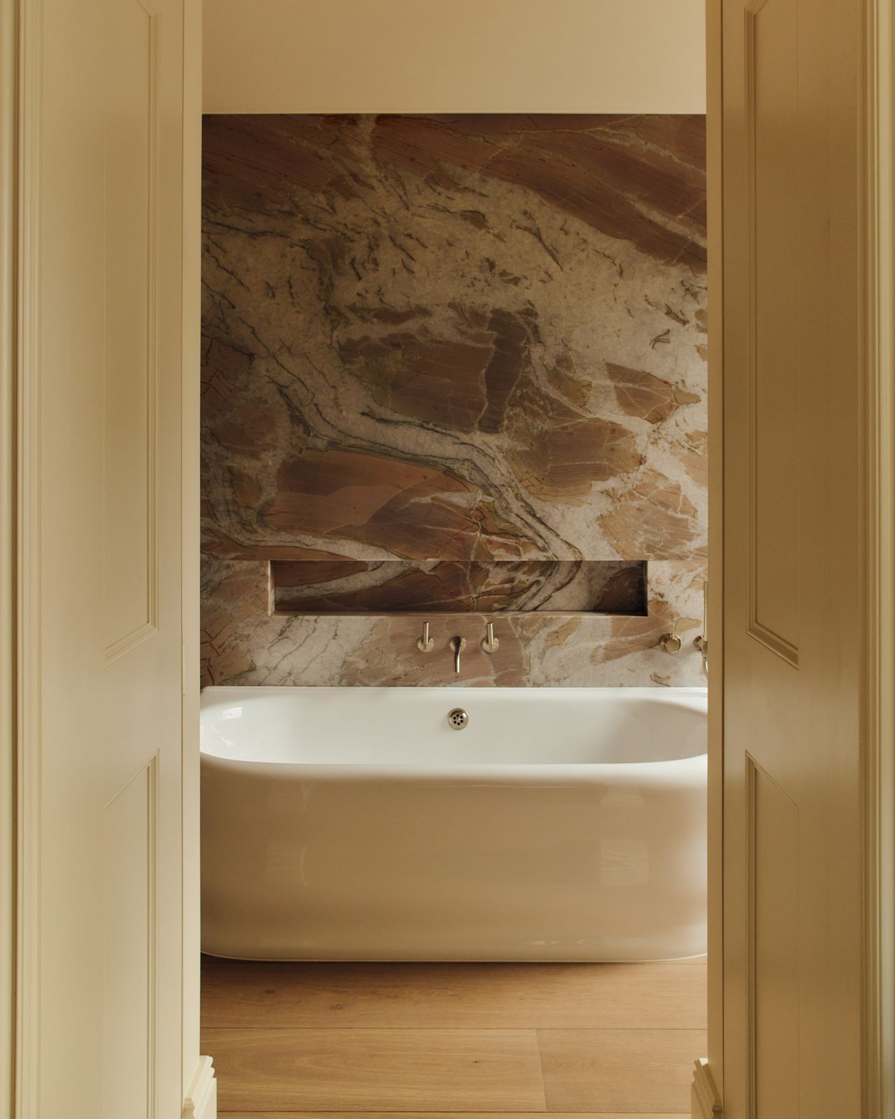 Gest bathroom area with marble panelled walls