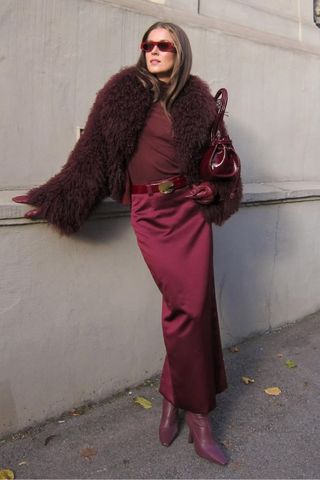 Nina Sandbech wearing burgundy outfit