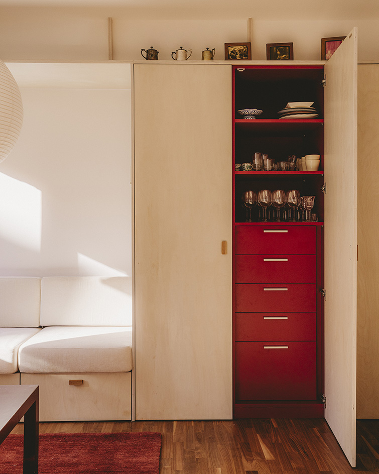 interior views of warm Barcelona apartment in red and neutral tones