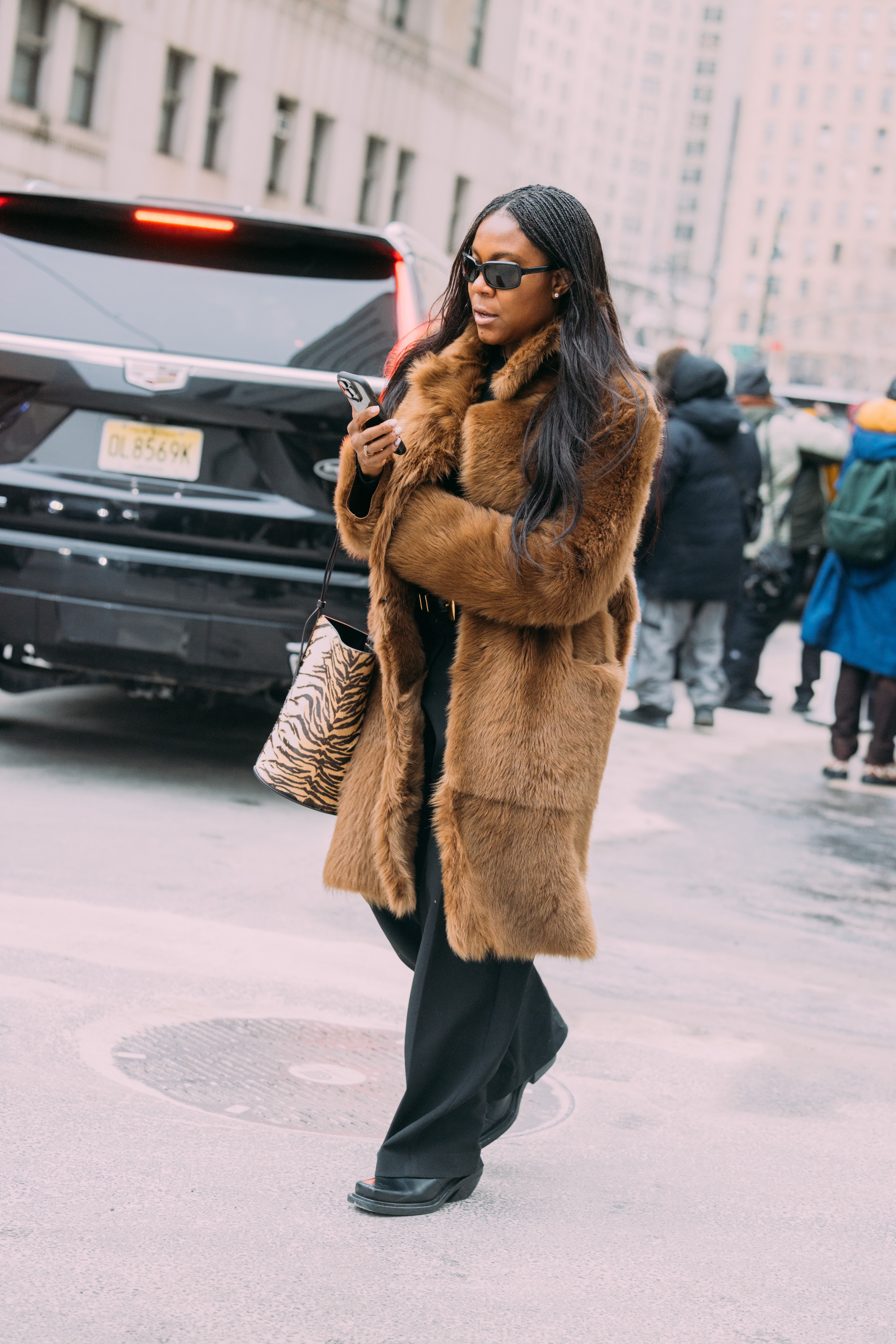 A woman wears black trousers during new york fashion week.