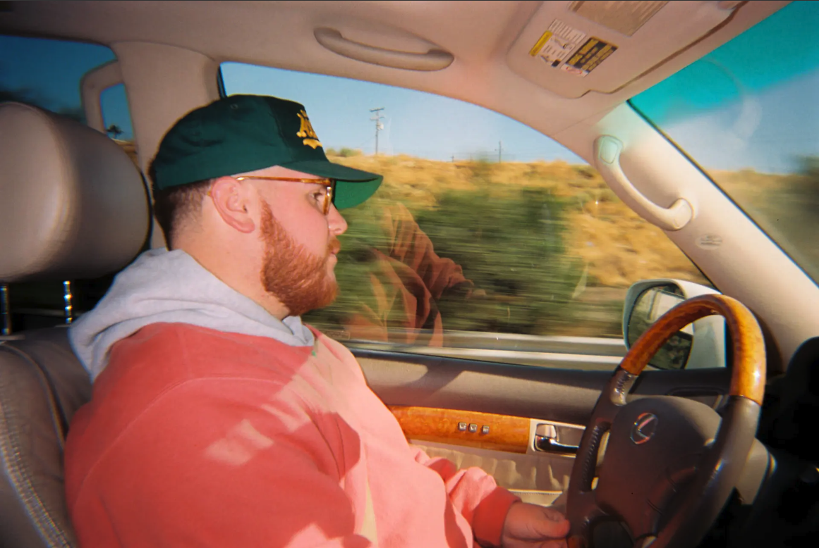 Photo of driver at the wheel, taken with the Moment Long Weekend 35mm Film Camera