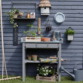 Navy fence panels with potting table