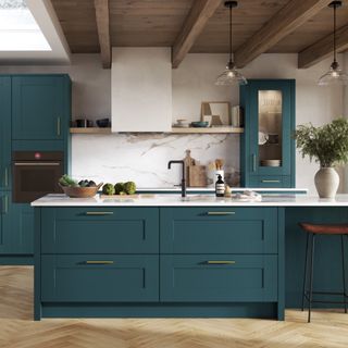 Blue shaker kitchen with wood floors