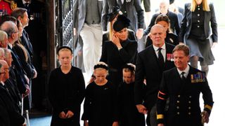 Savannah Phillips (left) Zara Tindall (centre) and Isla Phillips (second left), Lena Tindall and Mike Tindall (second right) arrive for the Committal Service for Queen Elizabeth II
