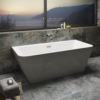 Verso Back to Wall White Bath, in a bathroom with stone marble tiles in front of a window with a view of the sunset over water