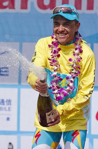 Valentin Iglinskiy (Astana) was all smiles as he sprayed the champers in his tour leader's yellow jersey in Sanya.