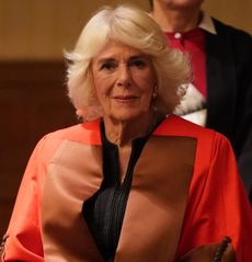 Queen Camilla wearing red university robes