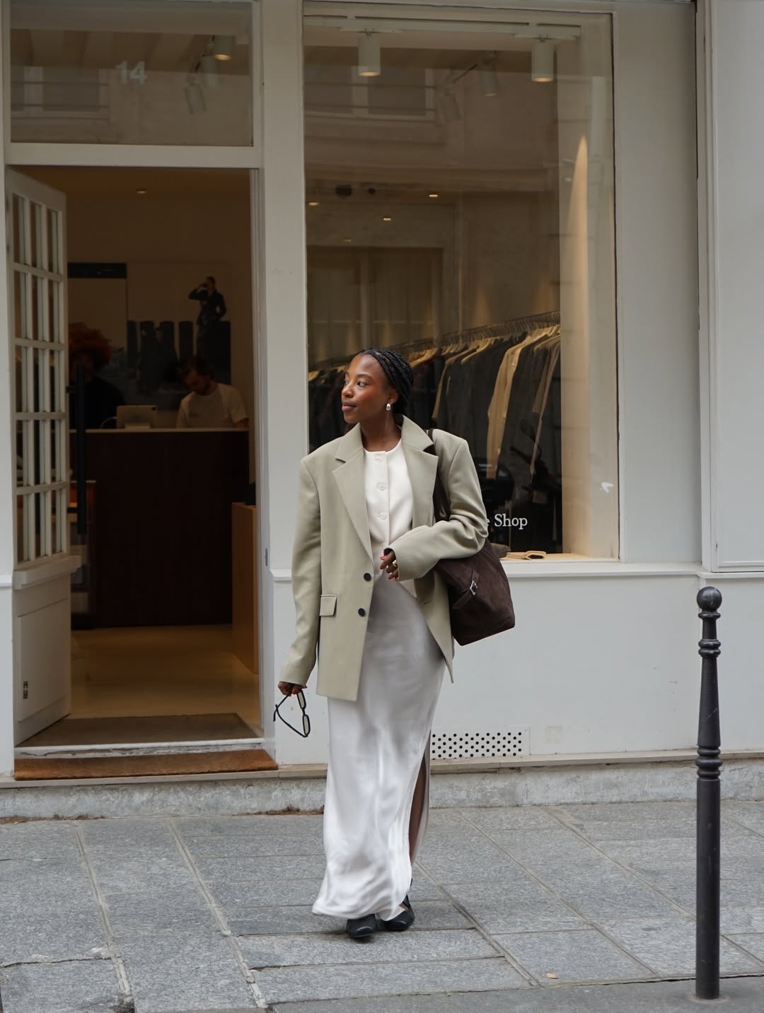 Taffy in a beige khaki blazer and white dress