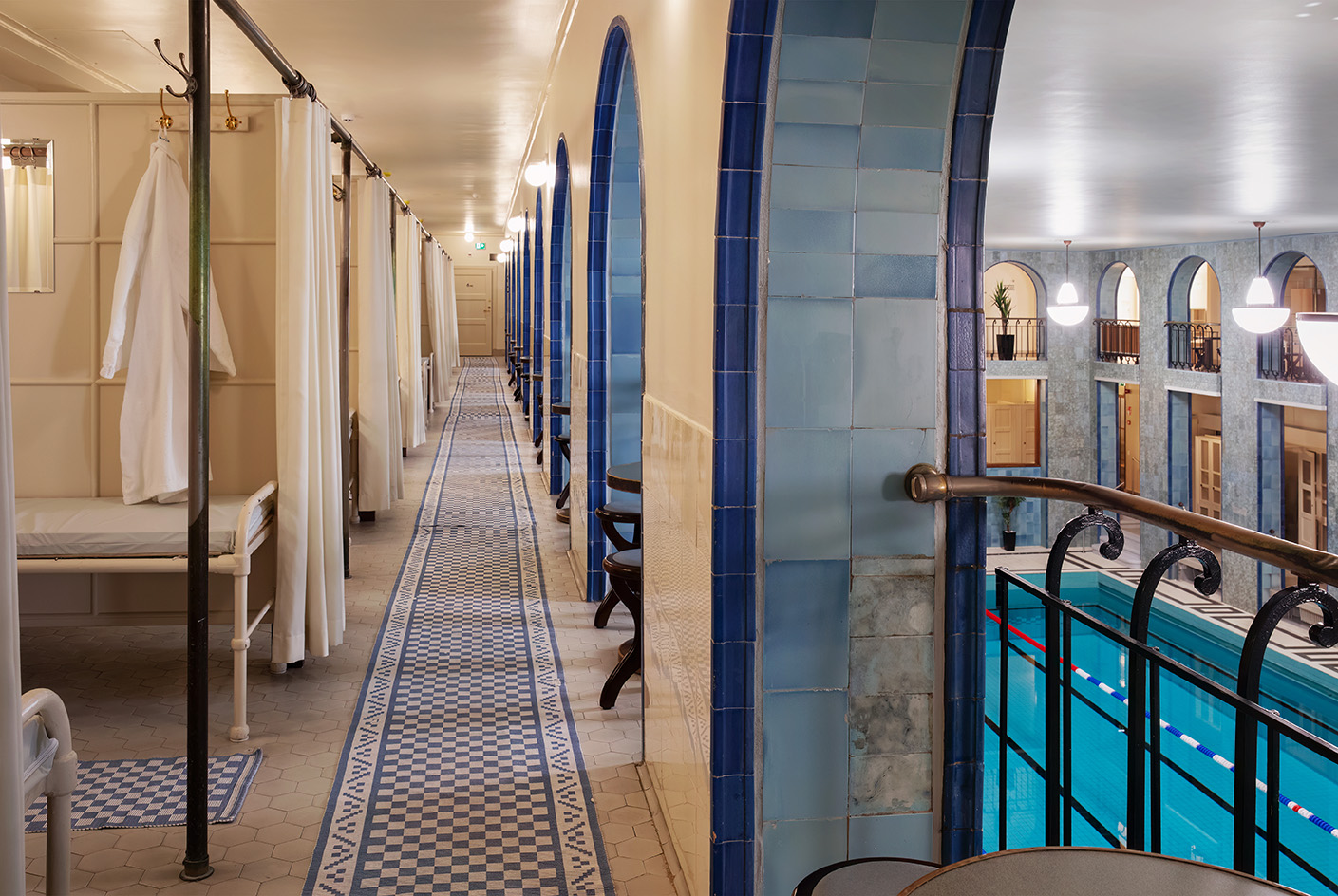 interior vista of Yrj&amp;ouml;nkatu, the indoors Helsinki swimming hall with its tall ceilings, art deco detailing and pool in the middle
